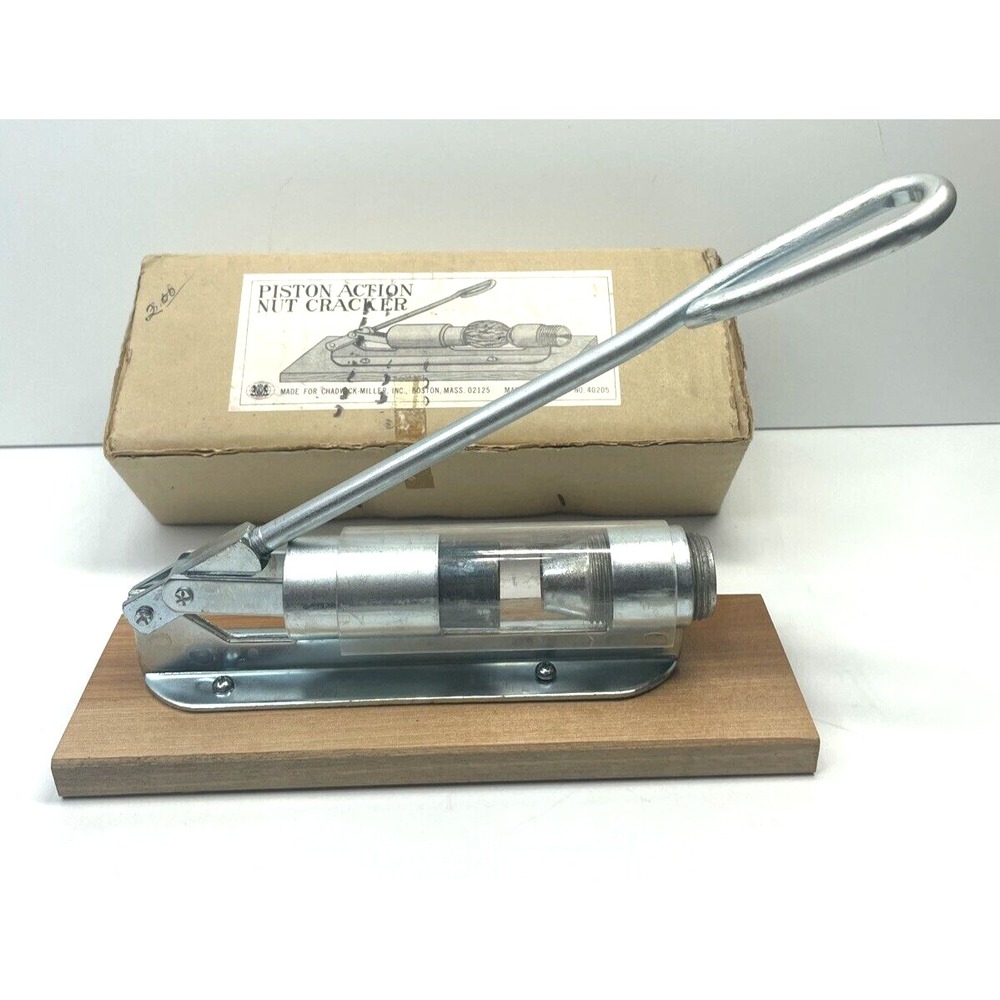 VINTAGE 1960'S PISTON-ACTION NUT CRACKER - METAL WITH WOOD BASE - MADE IN JAPAN